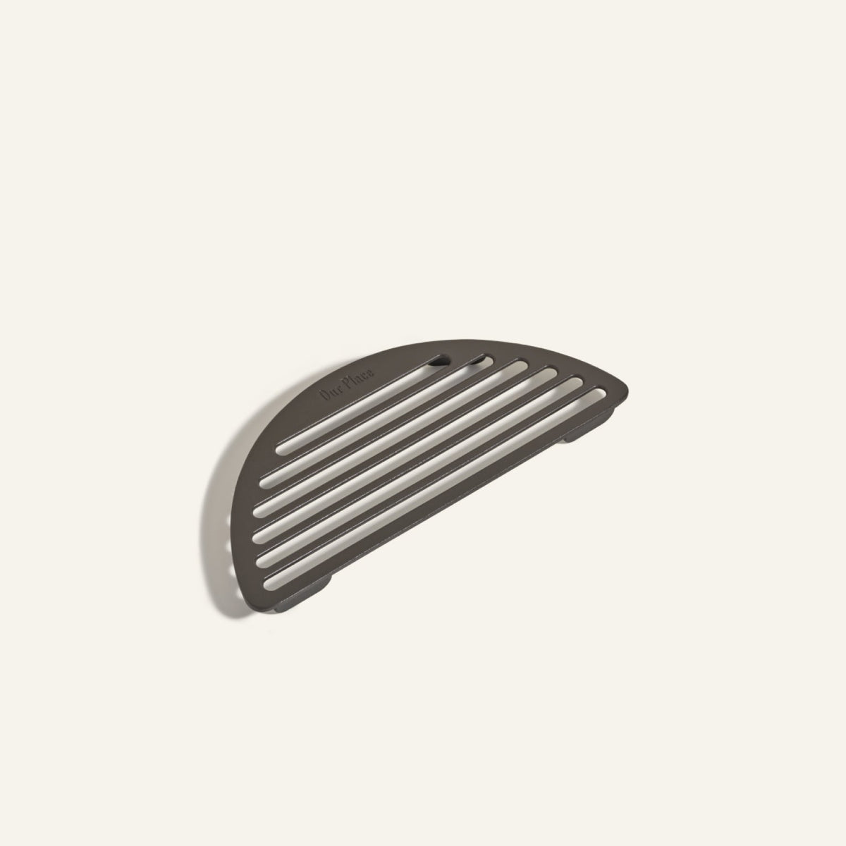 The Fry Deck is a matte-finish, semicircular slotted metal tray designed to pair seamlessly with Our Place cookware, shown on a plain light background.