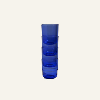 A set of four Short Night + Day Glasses is stacked vertically against a plain light background.