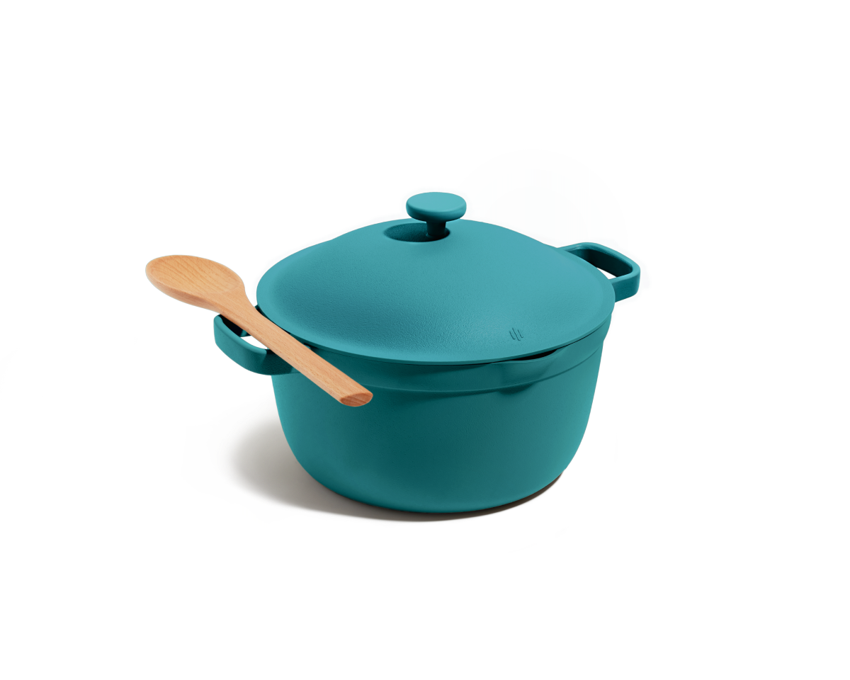 The Perfect Pot in teal, featuring an 8-in-1 nonstick design with lid and side handles, is pictured on a white background with a wooden spoon resting on top.