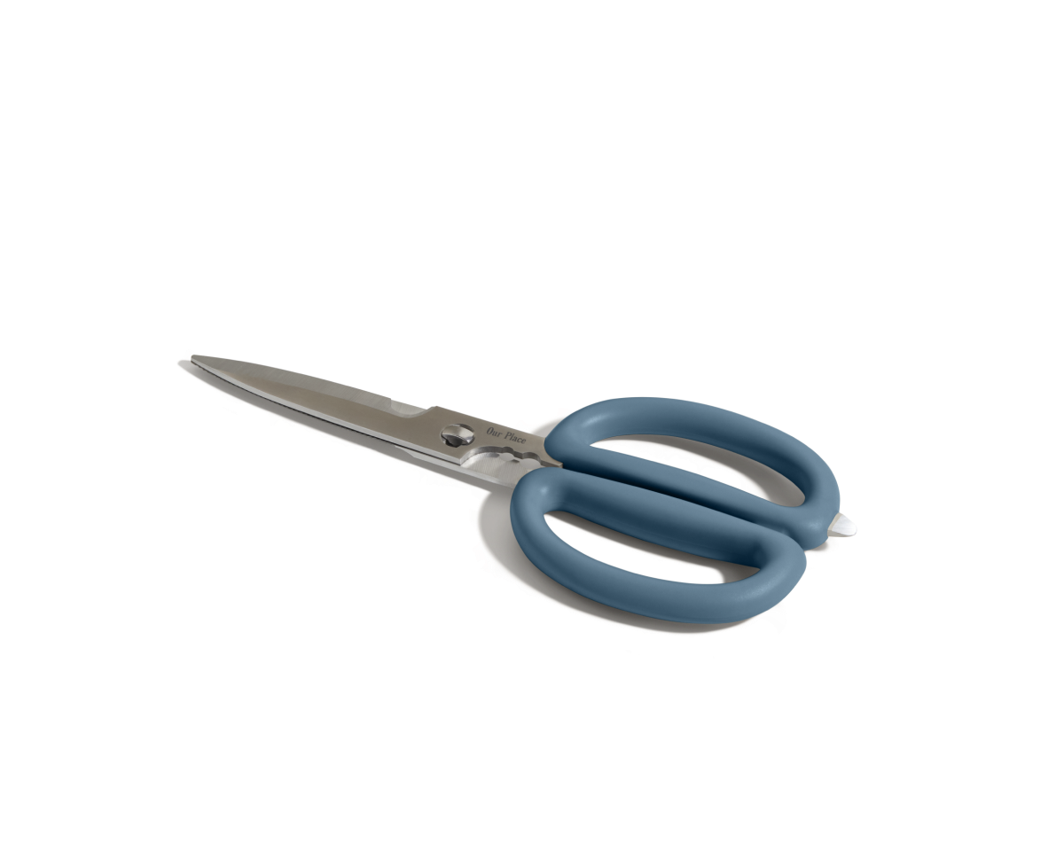 The Shear Genius kitchen shears, featuring stainless steel blades, large blue handles, and a multifunctional design, are shown on a white background.