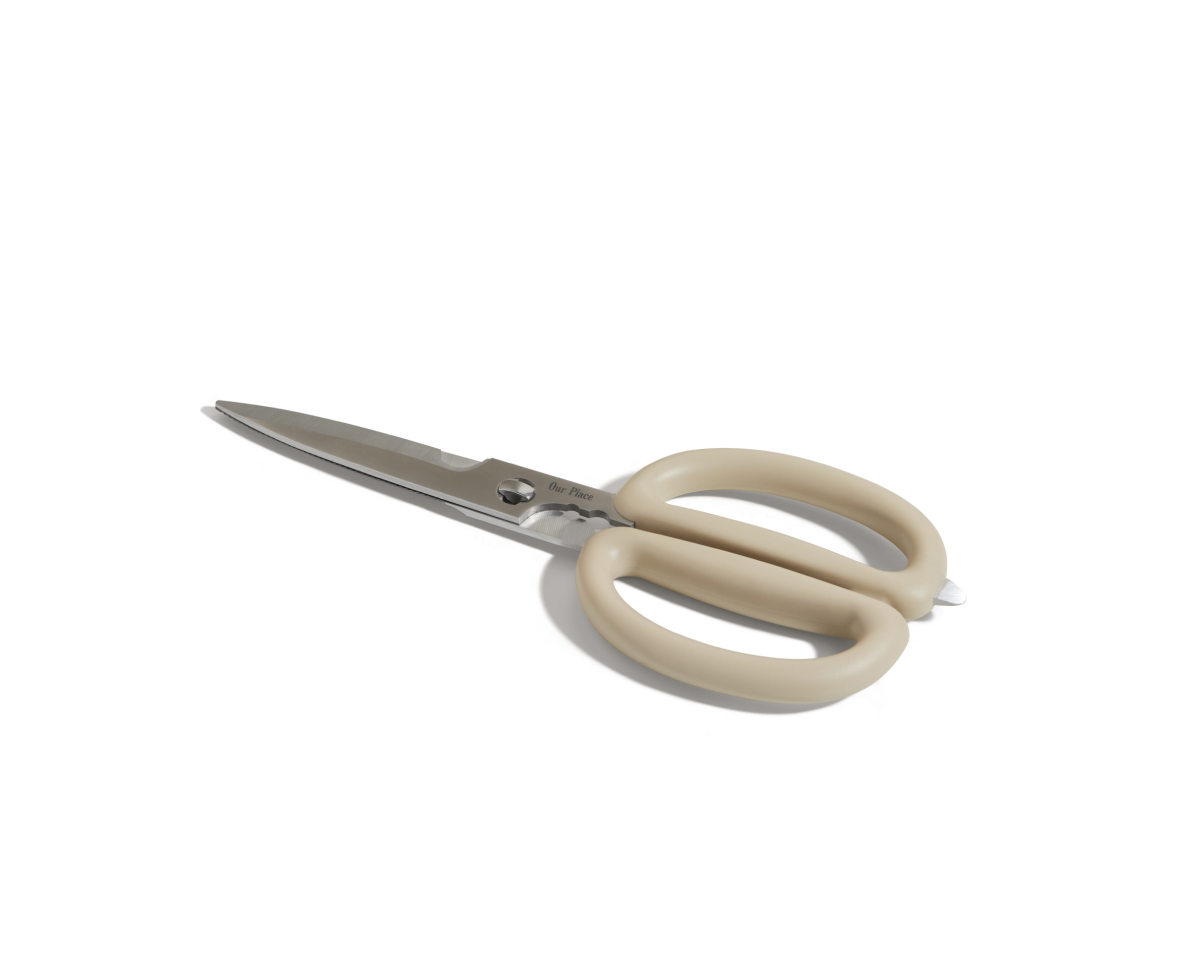 Shear Genius stainless steel kitchen shears with beige, oval handles and a multifunctional design are displayed on a white background.