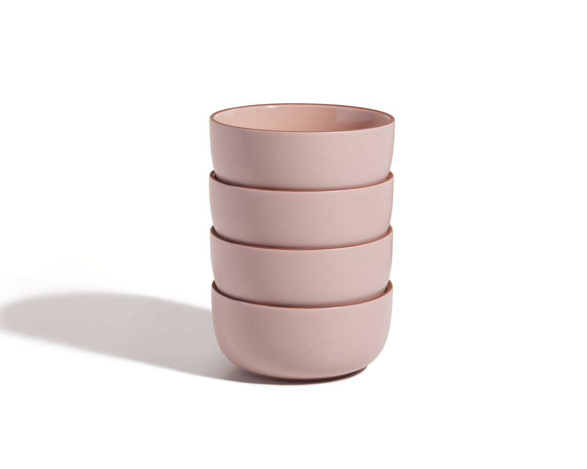 The Soup Bowls set includes four stackable pink ceramic bowls, arranged on a white background with a soft shadow to the left.