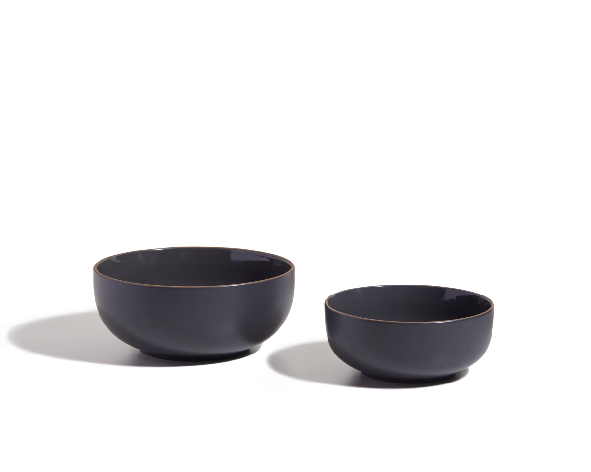 Two matte black Serving Bowls of different sizes are shown side by side on a white background, ideal as elegant salad bowls or stackable tableware for any modern kitchen.