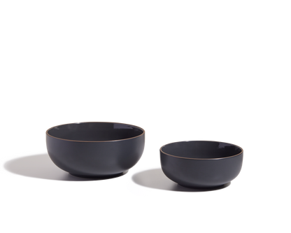 Two matte black Serving Bowls of different sizes are shown side by side on a white background, ideal as elegant salad bowls or stackable tableware for any modern kitchen.
