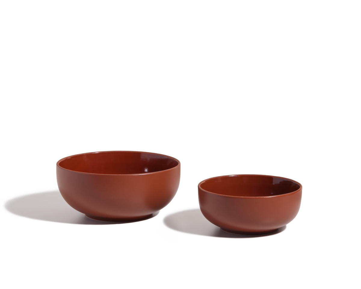 Two brown Serving Bowls of different sizes are placed side by side on a white surface with soft shadows, ideal as salad bowls or stackable tableware.