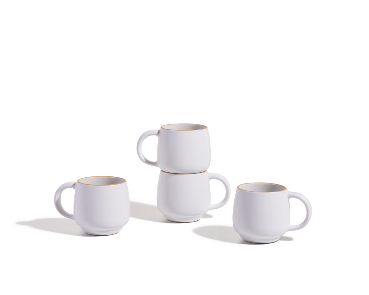 Four Night + Day Mugs, made of white ceramic stoneware, are displayed on a plain white surface—two mugs stacked and the other two placed next to them.