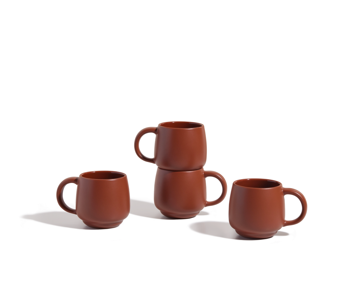 Four Night + Day Mugs are displayed on a white surface: two are stacked, while the other two stand apart, highlighting their ample capacity and modern ceramic stoneware design.