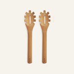Two identical Beechwood Serving Spoons with slotted, notched heads are placed side by side on a plain light background.