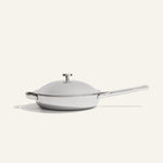 A stainless steel Titanium Always Pan Pro 10.5″ 2.0 skillet with a matching lid and a long handle.