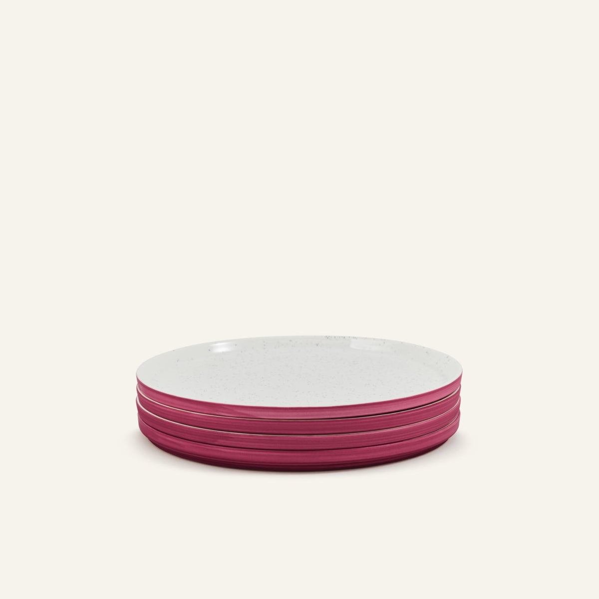 A stack of four Main Plates—porcelain with white tops and pink sides—set against a light background.