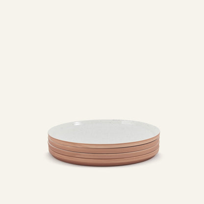 A stack of four Main Plates, each hand-painted with white speckled tops and brown unglazed sides, displayed on a light neutral background.
