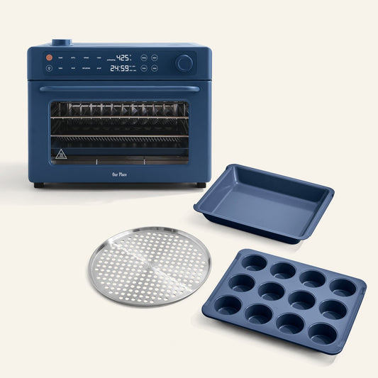 The Wonder Oven Pro + Wonder Oven Pro Chef's Kit is shown in blue with a metal baking rack, muffin pan, and square baking pan displayed in front of it.