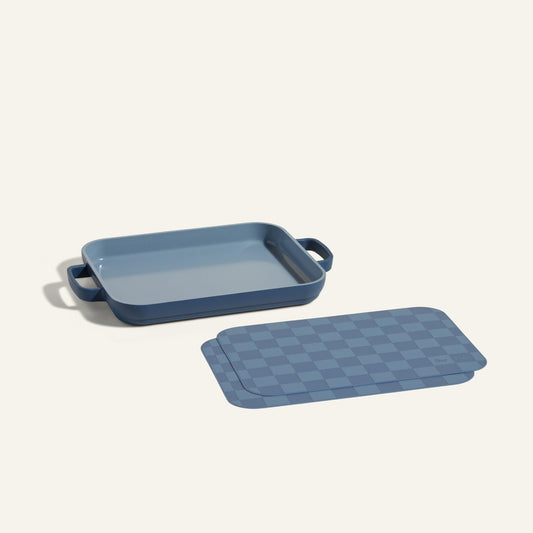 A Mini Griddle Pan is displayed beside matching Mini Oven Mats on a plain light background.