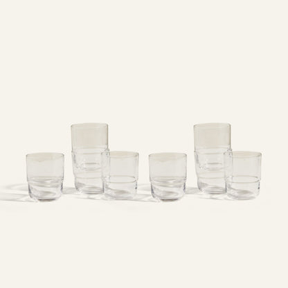 Six clear, empty Short Night + Day Glasses are arranged in two rows on a light background; three are stacked in pairs and three stand alone, highlighting these versatile handmade tumblers perfect for any occasion.