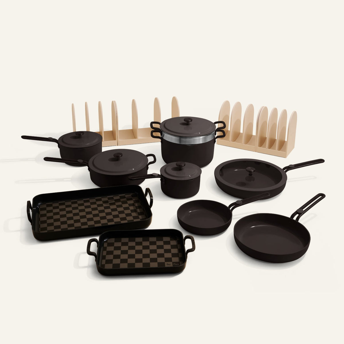 Set of black cookware including pots, pans, and skillets on a white background