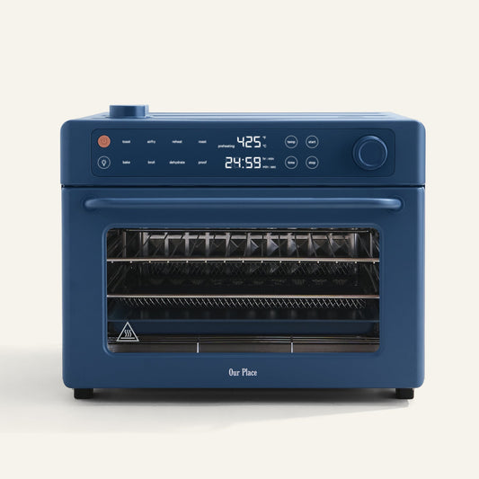 Blue oven with digital display on a white background